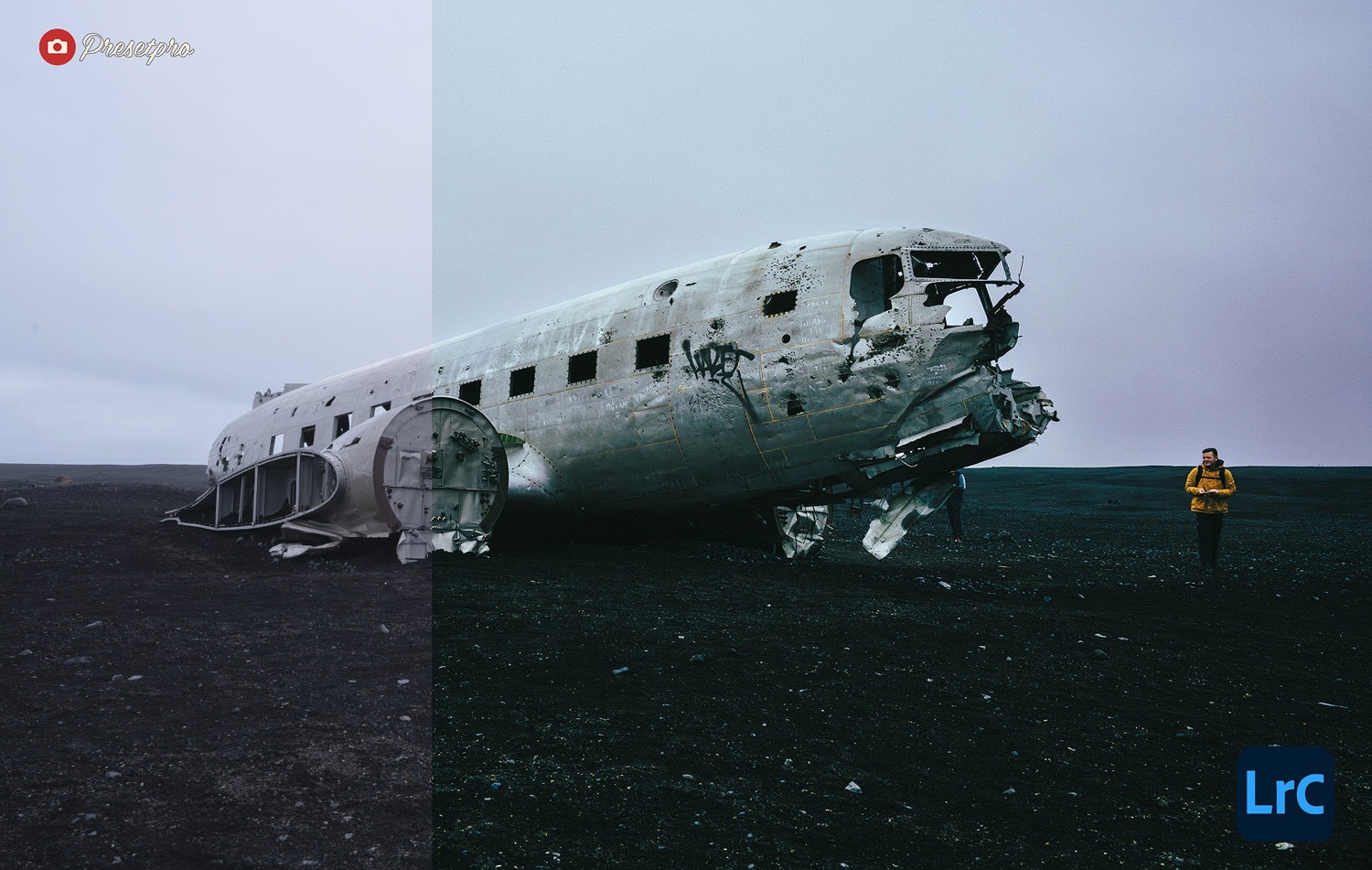 Man in yellow coat beside airplane wreck in Iceland.