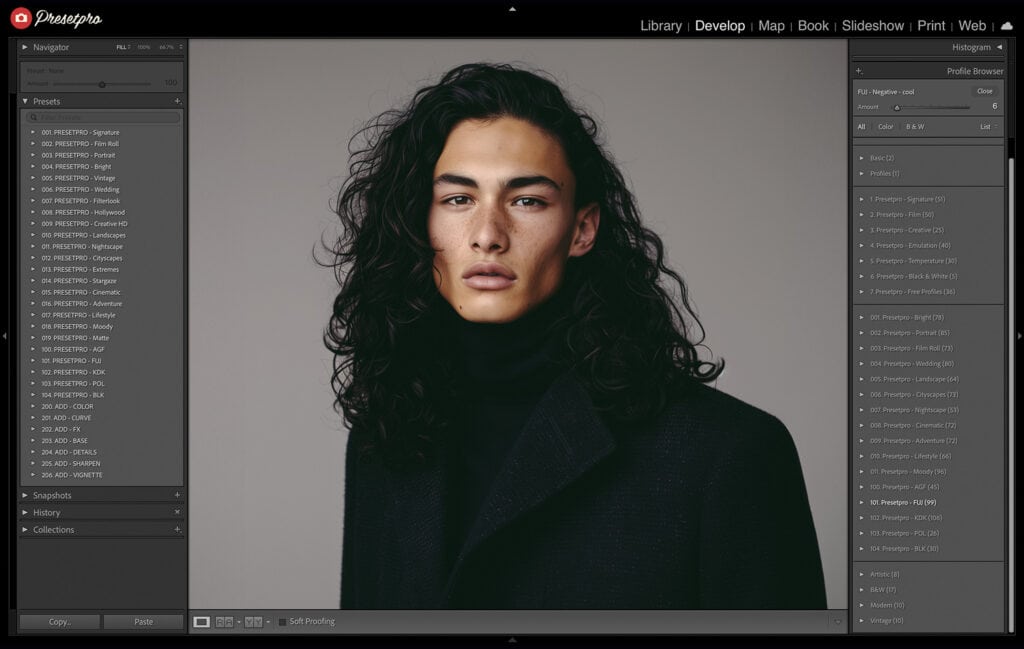 Final studio portrait of a male model with long dark hair, edited in Lightroom with FujiFilm 200 Color Negative Film Emulation preset and profile.