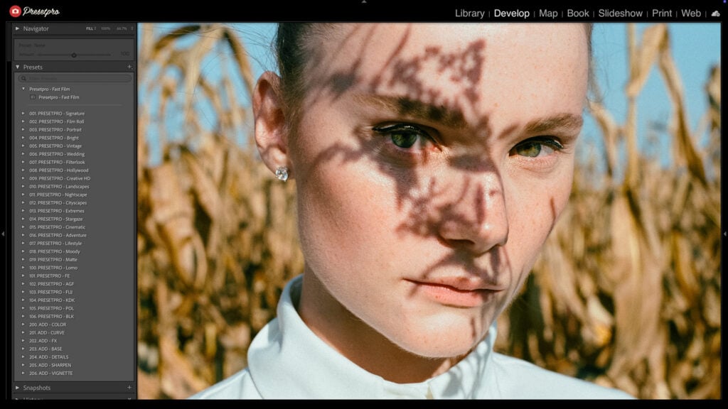 Edited portrait of a woman outdoors using the Kodak Portra 800 inspired Lightroom Preset with soft film grain and warm tones.