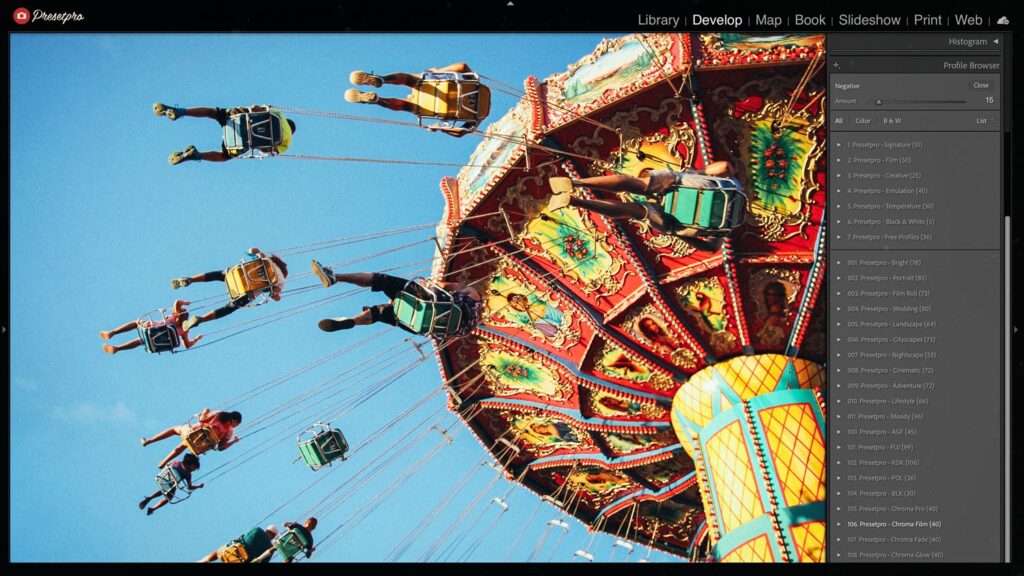Vibrant photo of a spinning carnival swing ride under a bright blue sky, enhanced with the Kodak Max 800-inspired Lightroom preset in Adobe Lightroom Classic, highlighting warm tones and nostalgic color shifts.