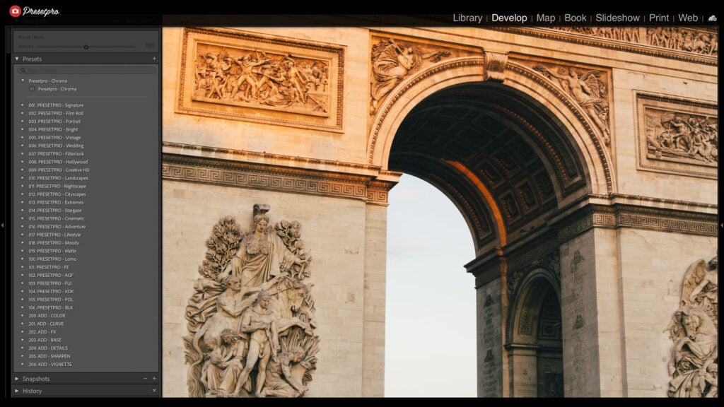 Stunning view of a historic Paris arch showcasing intricate sculptures and ornate design elements.
