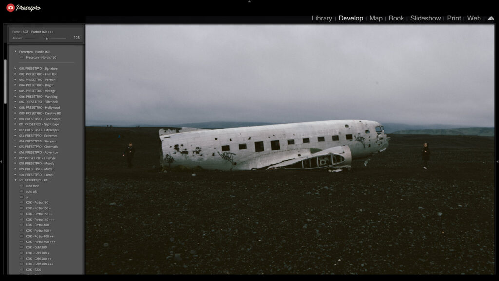 Abandoned airplane wreck on a dark, moody landscape in Iceland.