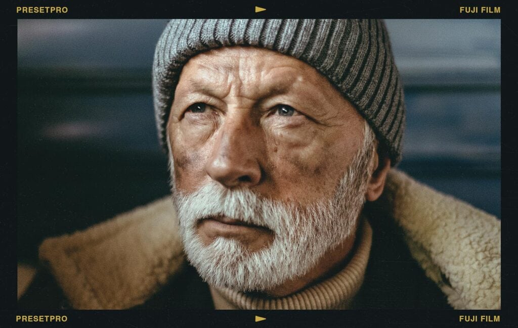 Portrait of an older man with a white beard and grey beanie edited with the Free Fuji Film Lightroom Preset for a cinematic look.