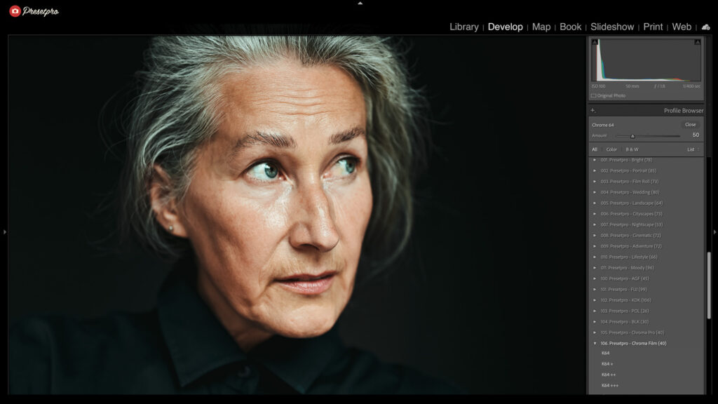 Woman with gray hair using cinematic fade Lightroom preset for a movie-style look.