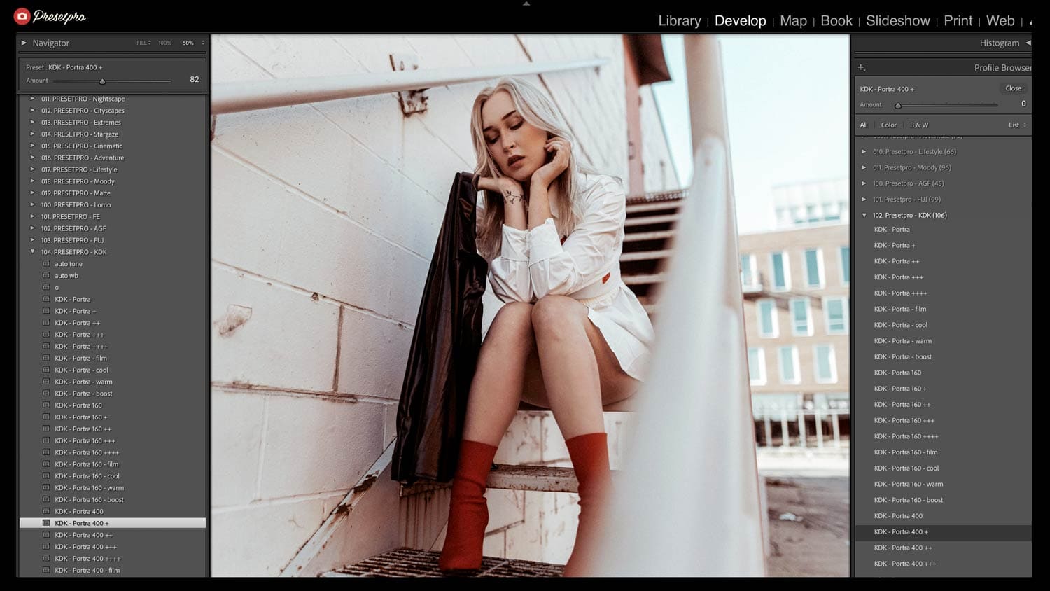 Fashion portrait of woman in white shirt and red socks on urban staircase, warm Kodak Portra 400 film emulation with soft lifted shadows and amber skin tone rendering.