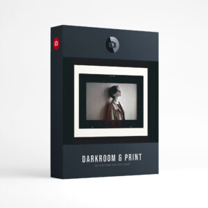 Film Frame Templates Pack 05: Darkroom & Prints product box: a black and white portrait of a woman in a coat leaning against a wall, in a 35mm frame on a cream print, above the words Darkroom & Print, film frame pack for Photoshop